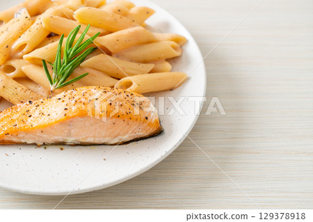 salmon with penne pasta cream sauce salmon with penne pasta cream sauce 129378918