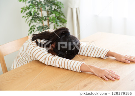 A middle school girl worried at home 129379196