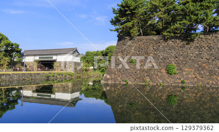 Ishigaki reflected in the moat Ishigaki reflected in the moat 129379362