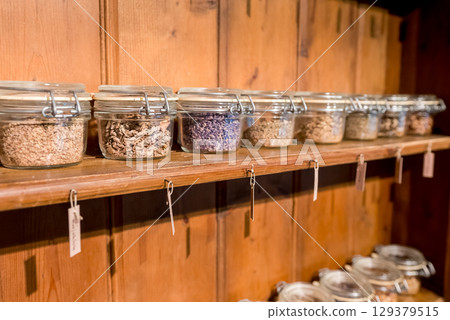 Jars filled with spices and herbs Jars filled with spices and herbs 129379515