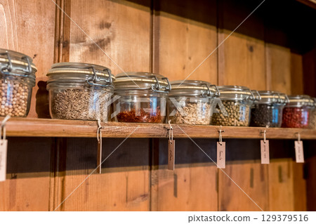 Jars filled with spices and herbs Jars filled with spices and herbs 129379516