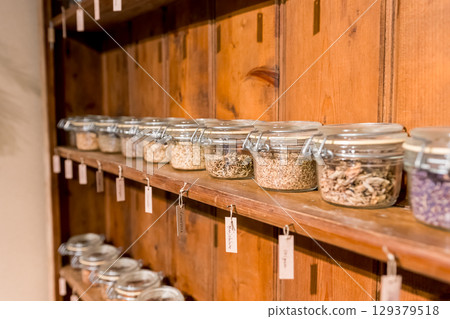 Jars filled with spices and herbs Jars filled with spices and herbs 129379518