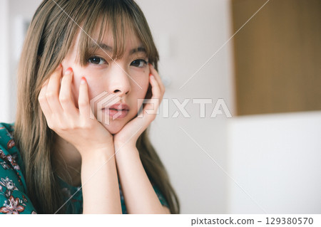 A young lady with a cheeks stick A young lady with a cheeks stick 129380570