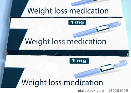 Weight loss medication Semaglutide injection pen boxes on blue background Weight loss medication Semaglutide injection pen boxes on blue background 129381629