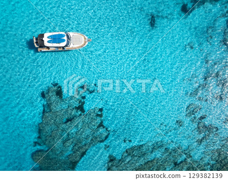Aerial view of yacht in clear turquoise sea, Mallorca, Spain 129382139