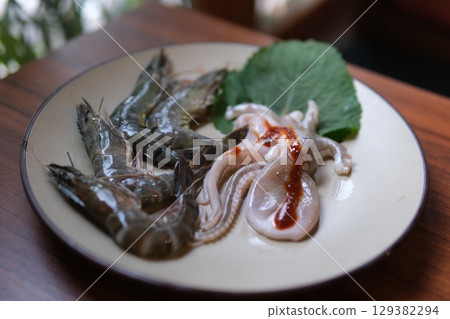 octopus squid cooking grill grills octopus seafood octopus mussels shrimp on hot bbq thai asian style, slow motion octopus squid cooking grill grills octopus seafood octopus mussels shrimp on hot bbq thai asian style, slow motion 129382294