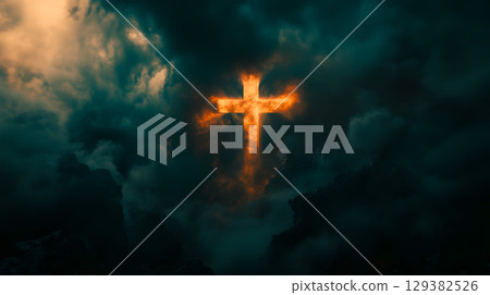 A glowing cross illuminates the darkened sky, symbolizing hope and resurrection in Christianity 129382526