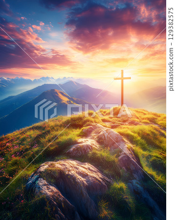 A serene sunset view of a crucifix on a mountain peak surrounded by breathtaking scenery A serene sunset view of a crucifix on a mountain peak surrounded by breathtaking scenery 129382575
