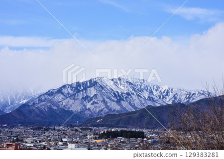 Shinshu scenery - Mount Jigatake in the Northern Alps shrouded in clouds 129383281