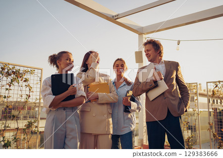 A Business Team Collaboration Focused on Effective Rooftop Meeting Dynamics and Strategies A Business Team Collaboration Focused on Effective Rooftop Meeting Dynamics and Strategies 129383666