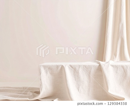 Minimalist interior with beige tablecloth and vase 129384338