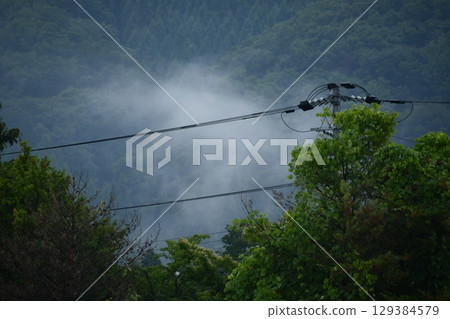 mountain covered with clouds mountain covered with clouds 129384579