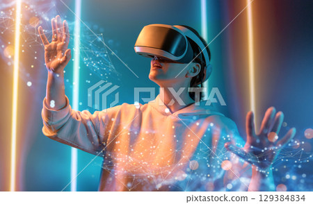 Woman with VR virtual reality goggles Woman with VR virtual reality goggles 129384834