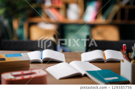Workbooks on desk in classroom 129385756