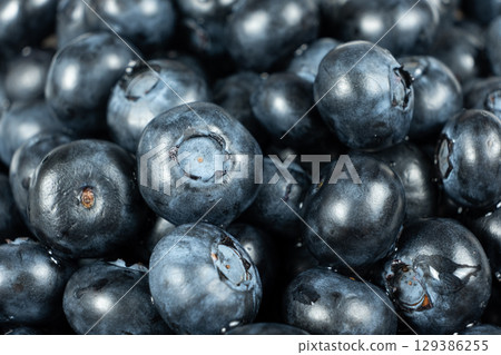 Fresh blueberries close-up, berry background Fresh blueberries close-up, berry background 129386255