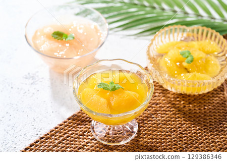 Three kinds of fruit jelly: yellow peach, white peach, and summer mandarin orange 129386346