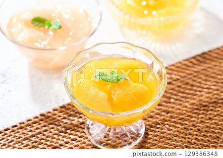 Three kinds of fruit jelly: yellow peach, white peach, and summer mandarin orange Three kinds of fruit jelly: yellow peach, white peach, and summer mandarin orange 129386348