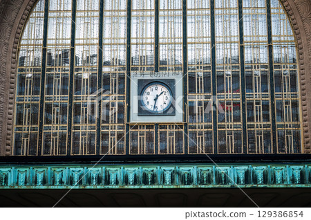 Clock on facade of Helsinki Central Railway Station building 129386854