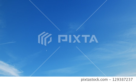 The Clear Blue Sky adorned with Whispy Clouds offers a breathtaking and tranquil view The Clear Blue Sky adorned with Whispy Clouds offers a breathtaking and tranquil view 129387237