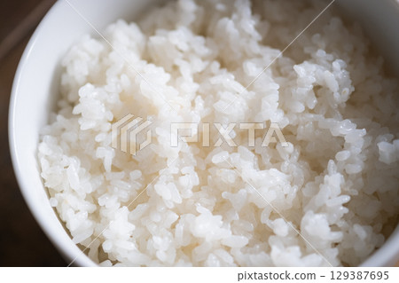 Image of rice served in a bowl (stock photo) Image of rice served in a bowl (stock photo) 129387695