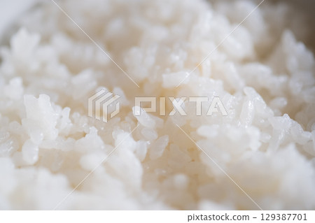 Image of rice served in a bowl (stock photo) Image of rice served in a bowl (stock photo) 129387701
