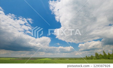 Expansive Skies Stretching High Above Lush Green Fields in Endless Natures Gorgeous Splendor Expansive Skies Stretching High Above Lush Green Fields in Endless Natures Gorgeous Splendor 129387926