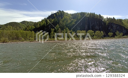 Picturesque Rocky Cliffside Landscape with Lush Green Trees and Calm River Scenery, Nature s Beauty Picturesque Rocky Cliffside Landscape with Lush Green Trees and Calm River Scenery, Nature s Beauty 129388324