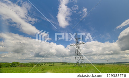 Electric high voltage pylon against sky. Transmission Towers on the Background of beautiful cloudy sky. Electricity Pylons and High Voltage Power Line. Ecology concept 129388756
