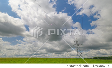 Electricity pylon or high voltage power line, black contour, on the background of the cloudy sky. Electricity pylon or high voltage power line, black contour, on the background of the cloudy sky. 129388793