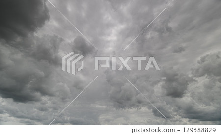A breathtakingly dramatic cloudy sky adorned with dynamic and mesmerizing patterns 129388829