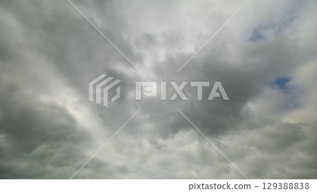 A stunning dynamic cloudscape is beautifully captured in motion, showcasing its ethereal beauty A stunning dynamic cloudscape is beautifully captured in motion, showcasing its ethereal beauty 129388838