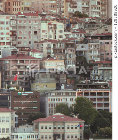 Istanbul, Turkey - 13 July 2025: Istanbul city downtown photographer with tele photo lens, close up 129388920