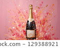 Champagne bottle on pink background with golden glitter on pink background. 129388921