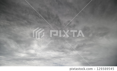 A Dramatic Overcast Sky Filled with Layers of Beautiful and Varied Clouds Above Us A Dramatic Overcast Sky Filled with Layers of Beautiful and Varied Clouds Above Us 129389545