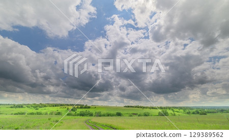 The Beautiful Sky Spreads Over a Lush, Green Landscape, Creating a Stunning Scene The Beautiful Sky Spreads Over a Lush, Green Landscape, Creating a Stunning Scene 129389562