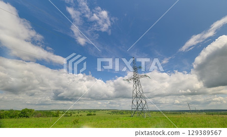 High voltage transmission tower or power tower and electrical distribution substation during day. Electricity pylon. 129389567