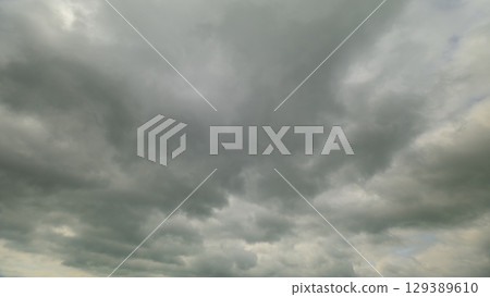Dramatic Overcast Skies Featuring Fluffy Clouds in a Beautiful Contrast with the Horizon Dramatic Overcast Skies Featuring Fluffy Clouds in a Beautiful Contrast with the Horizon 129389610