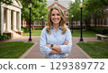 smiling woman standing in the park 129389772