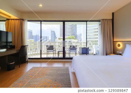 Hotel room with balcony overlooking the center of Bangkok, Thailand / Bangkok, Thailand Hotel room with balcony overlooking the center of Bangkok, Thailand / Bangkok, Thailand 129389847