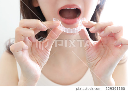 A woman wearing a mouthpiece A woman wearing a mouthpiece 129391160