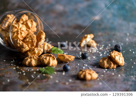 Homemade coconut cookies on a gray background. Healthy food concept. For advertising confectionery products Homemade coconut cookies on a gray background. Healthy food concept. For advertising confectionery products 129391306