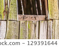 An Aged Weathered Wooden Structure Showcasing Unique Natural Textures and Intricate Details 129391644