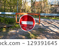 traffic restriction sign on a small road in a small village 129391645