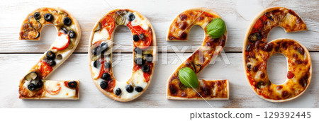 Happy new year 2026 - festive new year party background greeting card with text - Golden yellow fireworks in dark black night. Numbers written in pizza, banner 129392445