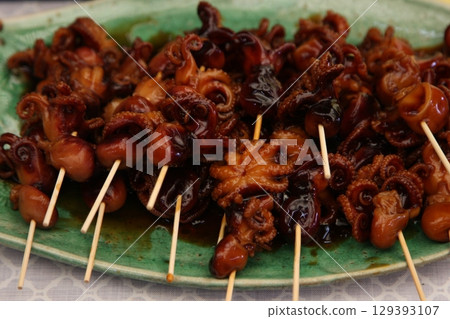 Boiled octopus served on a plate 129393107