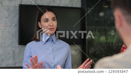 Close up man frustrated for argument, mistake in hotel lobby. Conflict, customer and manager with dispute, angry booking crisis and upset with service. 129393847