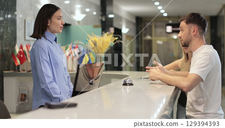 Man frustrated for argument, mistake in hotel lobby. Conflict, customer and manager with dispute, angry booking crisis and upset with service. Man frustrated for argument, mistake in hotel lobby. Conflict, customer and manager with dispute, angry booking crisis and upset with service. 129394393