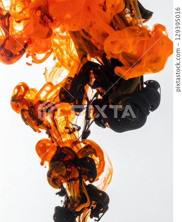 Orange and black ink spreading in water 129395016