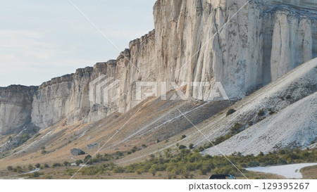 White rock Ak-Kaya in Crimea near Belogorsk illuminating by setting sun White rock Ak-Kaya in Crimea near Belogorsk illuminating by setting sun 129395267