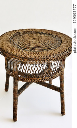 Brown wicker table with a brown top 129395777